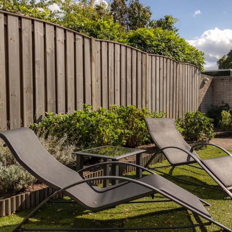 deck chairs by fence